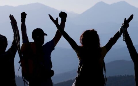 people-mountain-cheering-banner